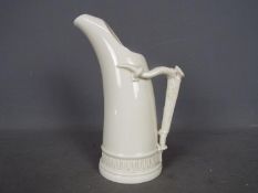 A Royal Worcester ice jug in the form of a tusk with relief moulded 'antler horn' handle,