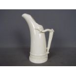 A Royal Worcester ice jug in the form of a tusk with relief moulded 'antler horn' handle,