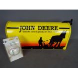 A novelty US style John Deere mail / post box, approximately 25 cm x 48 cm x 18 cm and a baseball.