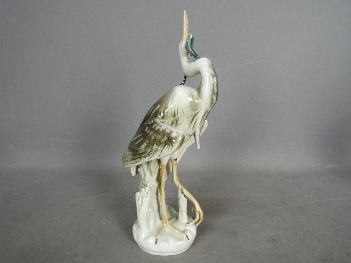 Royal Dux - Two bird figurines comprising a feeding heron and a peahen (one leg detached but - Image 5 of 11