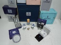 Lladro Collectors - Small items and gift boxes- Two Lladro Plaques, Two dogs, miniature plate,