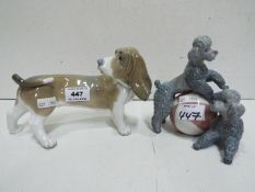 Lladro Two Dog figures. Blue factory marks and impressed numbers. Tallest 15cm high.