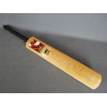 A Morrant cricket bat bearing signatures of Yorkshire and Lancashire including Geoffrey Boycott,