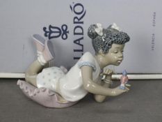 Lladro - A boxed figurine entitled Sing With Me, # 5837, depicting a young girl with a small bird,