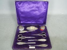 A George V hallmarked silver grooming set in fitted case, Birmingham assay 1919,