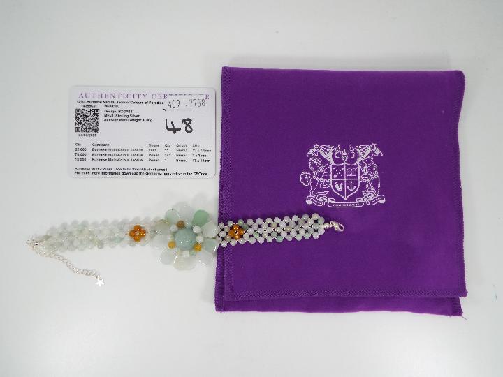 A 121 ct Burmese Natural Jadeite 'Colours of Paradise' flower bracelet set with silver, - Image 6 of 6
