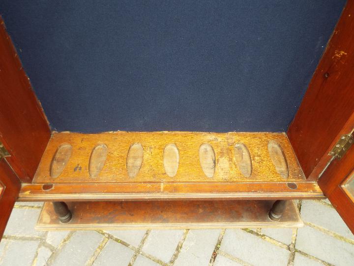 A vintage gun cabinet with twin glazed doors, approximately 147 cm x 93 cm x 28 cm. - Image 3 of 4