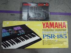 A Yamaha Portatone PSR-185 keyboard,