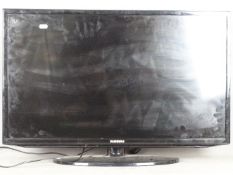 A 32" Samsung LCD television, model number UE32EH5000.