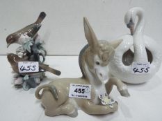 Lladro Three animal figures. Blue factory marks and impressed numbers.