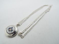 Silver - a silver pendant and chain,