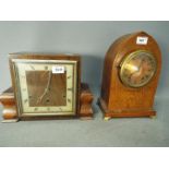 Two mantel clocks comprising a lancet to