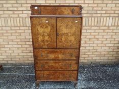 A burr walnut veneered dressing table wi