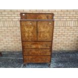 A burr walnut veneered dressing table wi