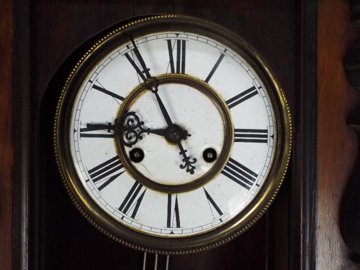 A mahogany cased wall clock with pendulu - Image 2 of 4