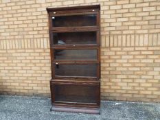 A sectional, stacking bookcase, with bas