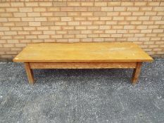 An antique pine coffee table, approximat