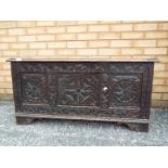 A highly carved chest measuring approxim