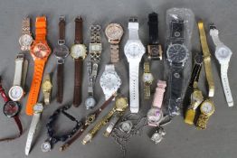 A varied collection of fashion watches.