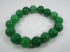 A 243.50 ct Burmese Green Jade stretchab