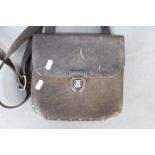 A vintage leather bus driver's pouch wit