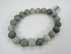 A 155.50 ct Moss-in-Snow Burmese Jade el