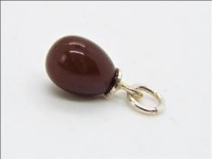 A 4.13ct American Fire opal egg pendant
