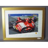 A signed image depicting Troy Bayliss riding for Ducati, framed under glass,