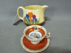 Clarice Cliff - A Bizarre, Crocus pattern milk jug for Newport Pottery, shape 36, approximately 9.