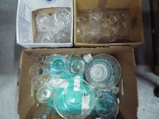 Three boxes of mixed glassware, decanters, bowls, drinking glasses and similar.