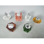Tobacciana - Six glass table lighters of varying design, clear glass and coloured glass.