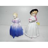 Two Royal Doulton figurines entitled Marie and Sharon,