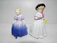 Two Royal Doulton figurines entitled Marie and Sharon,