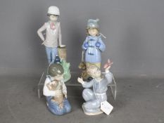 Nao - Four unboxed figurines of children with pets and toys, largest approximately 23 cm (h).