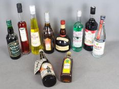 A collection of alcoholic drinks to include absinthe, sake, Grand Marnier, ouzo and similar,