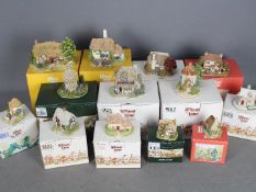 Thirteen boxed Lilliput Lane models to include Tea Caddy Cottage, Jones The Butcher, Pussy Willow,