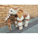 A Burmese ornately decorated articulated wooden elephant, from the Mandalay Puppet Theatre,