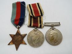 A World War Two (WWII / WW2) medal group comprising Defence Medal, War Medal and 1939 - 1945 star.