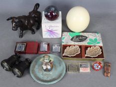 A mixed lot of collectables to include blown ostrich egg, pair of field glasses, cigarette lighters,