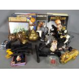 Lot to include a quantity of vinyl records, guitar stands, Laurel and Hardy figurines,