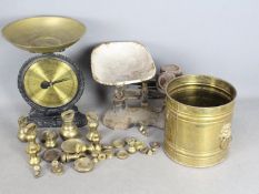 Two sets of kitchen scales and a quantity of various brass weights.