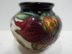A Moorcroft ceramic Anna Lily vase, approx 7.