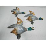 A set of ceramic flying ducks,