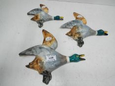 A set of ceramic flying ducks,