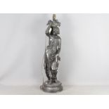 A large cast metal lamp in the form of a lady carrying baskets of fruit, approximately 80 cm (h).