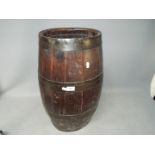A good quality, oval section, coopered barrel, approximately 60 cm (h).