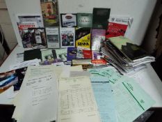 A collection of motorsport related ephemera to include DVD's, race meeting official programmes,