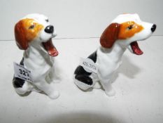 A pair of Royal Doulton dogs,