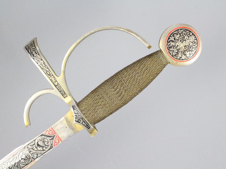 A vintage walking cane with white metal mount, riding crop and a decorative Spanish sword. - Image 2 of 3