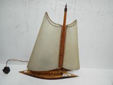 A vintage lamp in the form of a yacht,